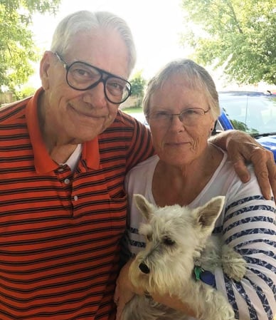 Dr. Jim Talley pictured with wife, Joyce, and their dog.