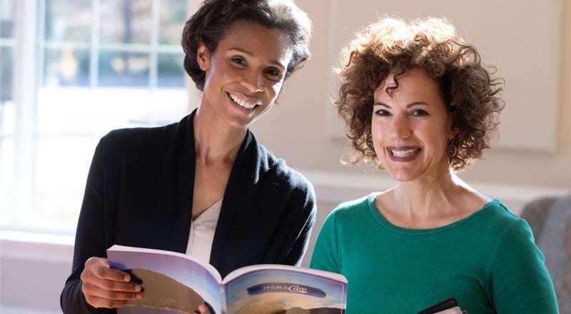 Women holding a recovery workbook